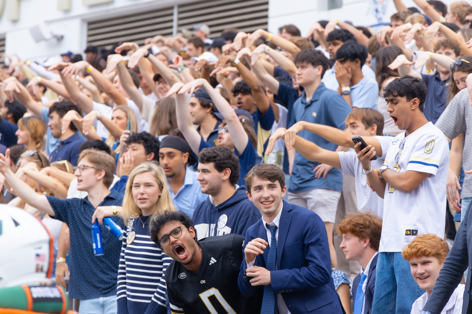 students cheering at football game